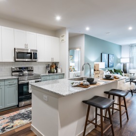 kitchen island with stools and cabinets
